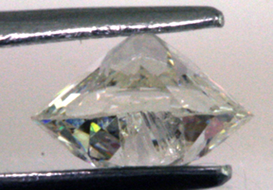Chip on crown of .97 ct. Old European and thin girdle